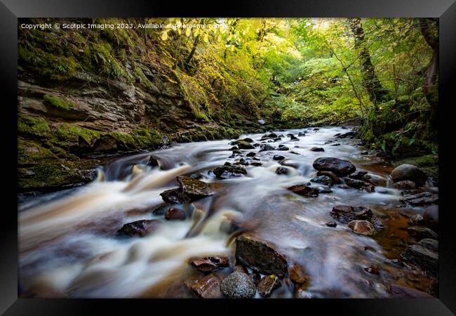 Slow exposure river with stones Framed Print by A Chisholm