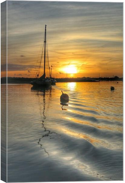 Sunrise colours and reflections over Brightlingsea Harbour in Essex  Canvas Print by Tony lopez