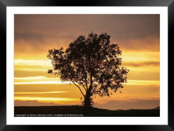 A sunset over a body of water Framed Mounted Print by Simon Johnson