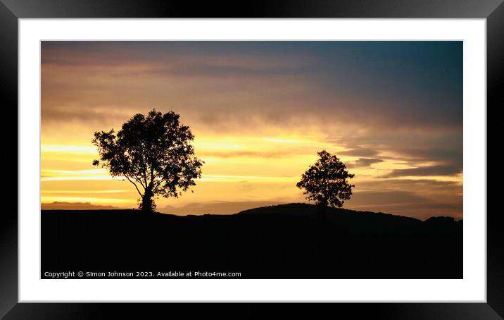 A tree with a sunset in the background Framed Mounted Print by Simon Johnson