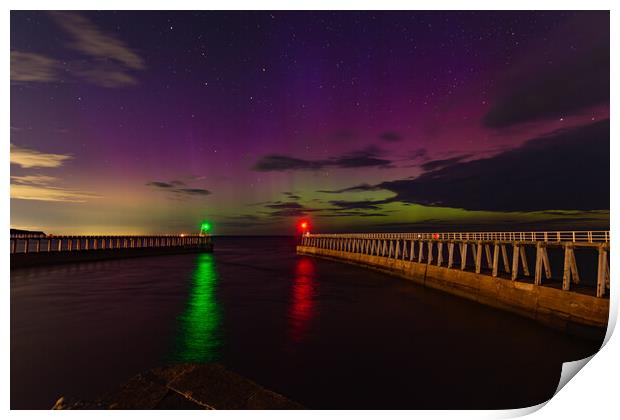 Northern Lights over the piers in Whitby Print by Kevin Winter
