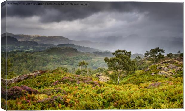 Holme Fell Rain Showers Canvas Print by John Dunbar