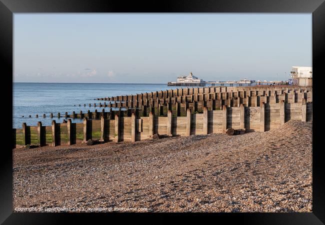 Eastbourne Pier and Beach with a clear blue sky and calm seas, Eastbourne, England Framed Print by Dave Collins