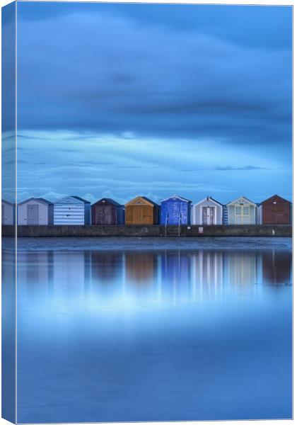 Early morning blue over Brightlingsea beach huts  Canvas Print by Tony lopez