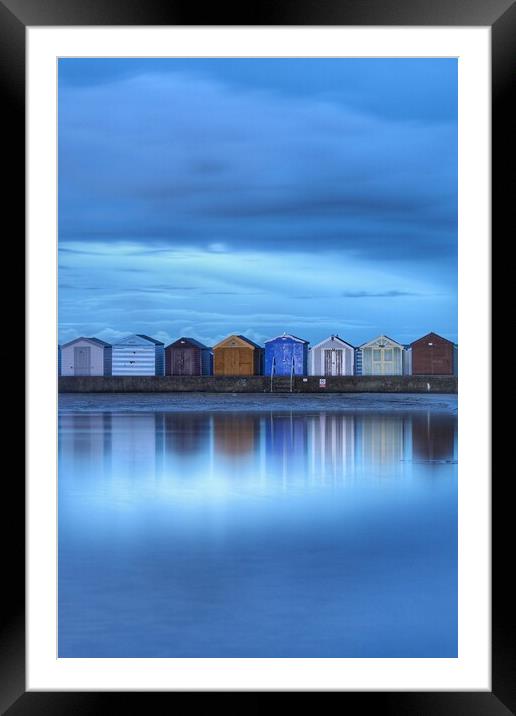 Early morning blue over Brightlingsea beach huts  Framed Mounted Print by Tony lopez