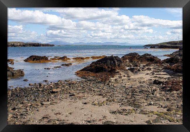 Serene landscape of Borthwen Beach Framed Print by Derek Daniel