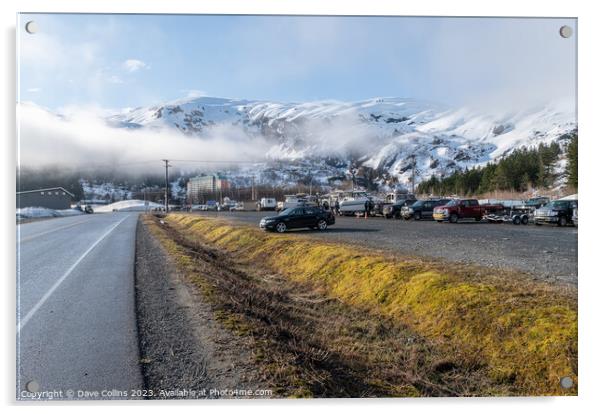 The main car and boat trailer parking area in Whittier with the  Begich Towers Condominium building and fog and snow mountains , Whittier, Alaska, USA Acrylic by Dave Collins