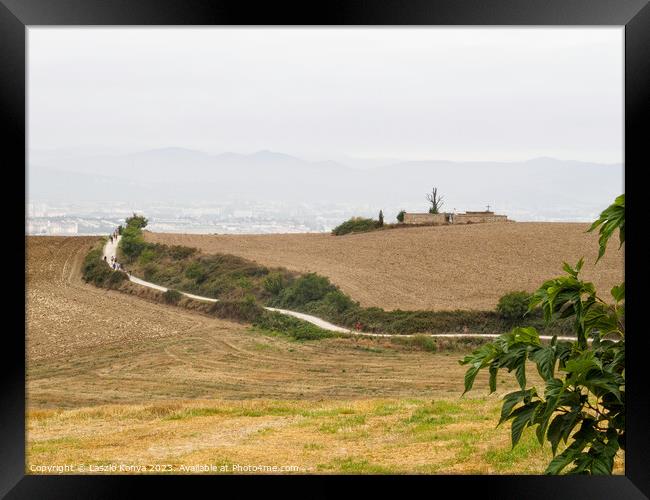 Pilgrims on the Camino - Pamplona  Framed Print by Laszlo Konya