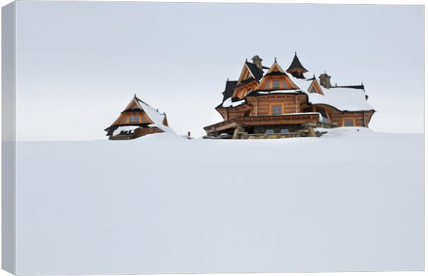  Village in winter Canvas Print by Olga Peddi