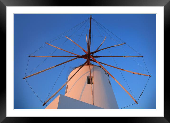 Santorini windmill with the bleu sky Framed Mounted Print by Olga Peddi