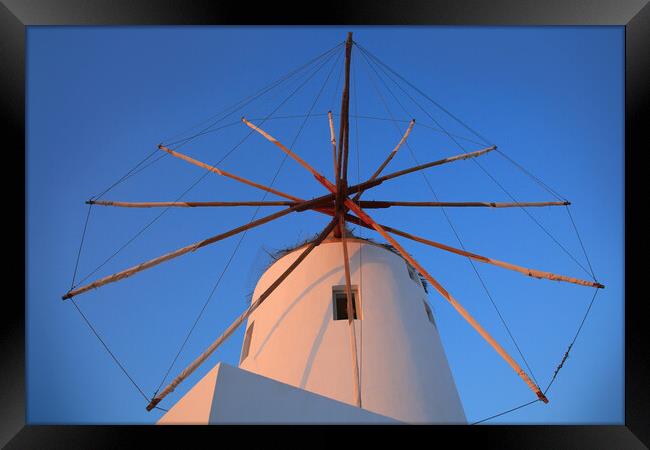 Santorini windmill with the bleu sky Framed Print by Olga Peddi