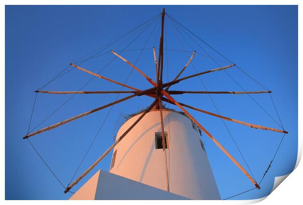 Santorini windmill with the bleu sky Print by Olga Peddi