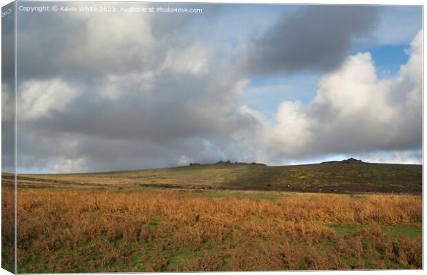 Rain clouds forming over Staple tors in Devon Canvas Print by Kevin White