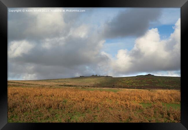 Rain clouds forming over Staple tors in Devon Framed Print by Kevin White