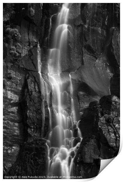 A waterfall cascading down black rock cliff Print by Alex Fukuda