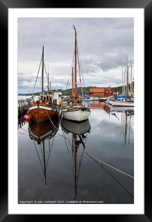 Boat reflection in the fjord Framed Mounted Print by Iain Lockhart
