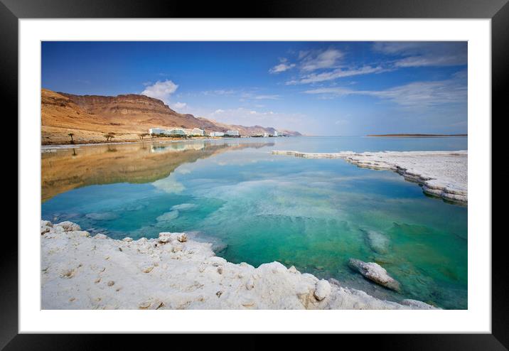Salt deposits, typical landscape of the Dead Sea. Framed Mounted Print by Olga Peddi