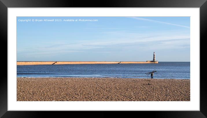 Man carrying driftwood, Roker beach, Sunderland. Framed Mounted Print by Bryan Attewell