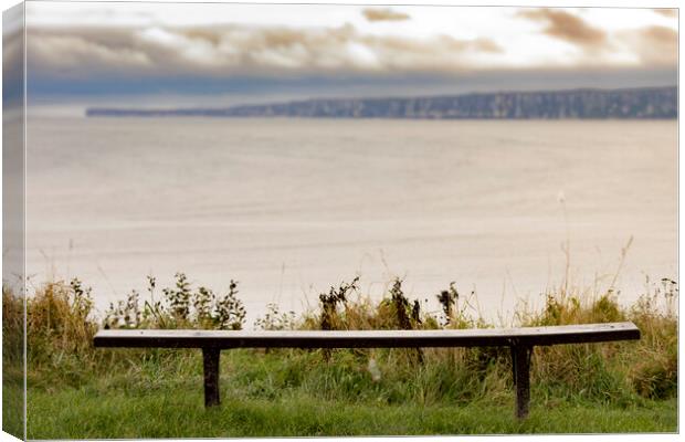 A bench view over Filey Bay Canvas Print by Glen Allen