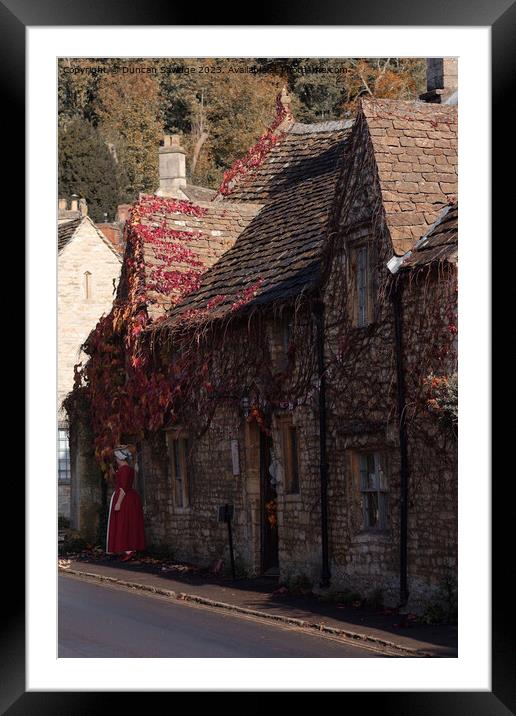 Red Autumn leaves at Castle Combe  Framed Mounted Print by Duncan Savidge