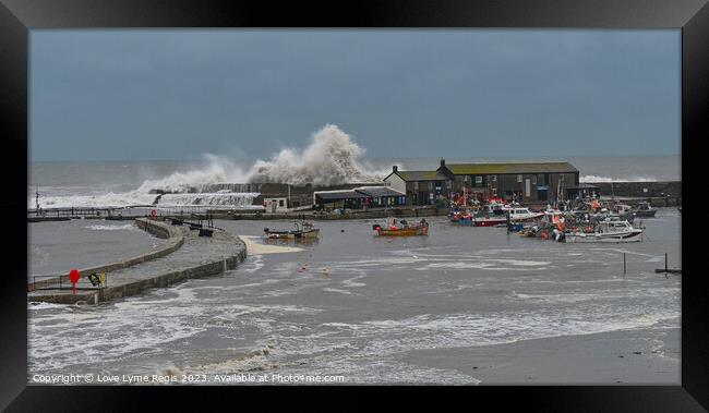Waves crashing into the Cobb at Lyme Regis Dorset UK Framed Print by Love Lyme Regis