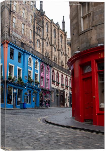 Colourful shops on the historic Victoria Street in Edinburgh Canvas Print by Christopher Keeley