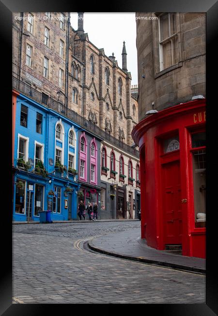 Colourful shops on the historic Victoria Street in Edinburgh Framed Print by Christopher Keeley