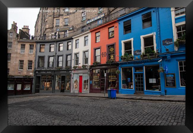 Colourful row of shops on Victoria Street, Edinburgh Framed Print by Christopher Keeley
