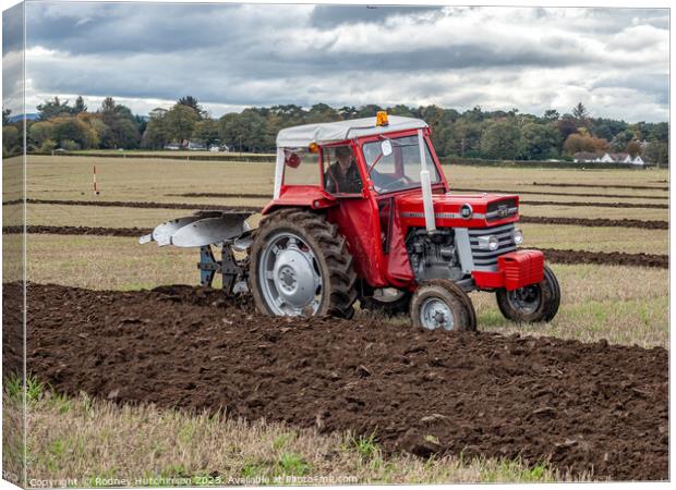 Tractor Ploughing Canvas Print by Rodney Hutchinson