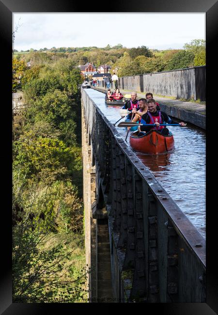 Canoes on the viaduct Framed Print by Clive Wells