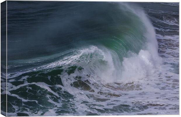 Wild wave in Nazare at the Atlantic ocean coast of Canvas Print by Olga Peddi