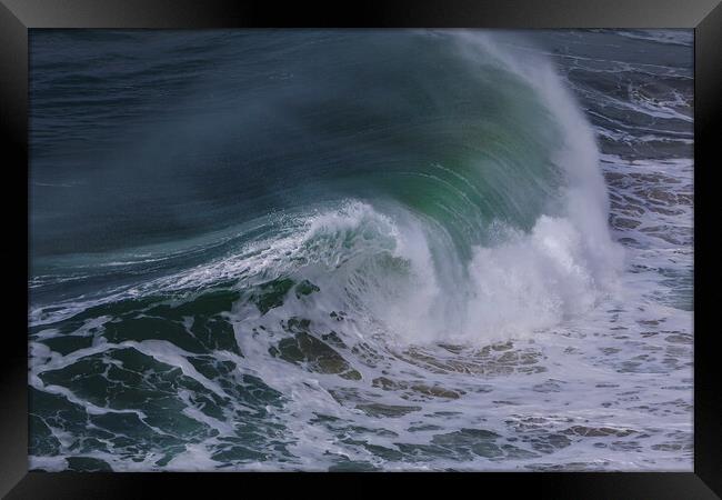 Wild wave in Nazare at the Atlantic ocean coast of Framed Print by Olga Peddi