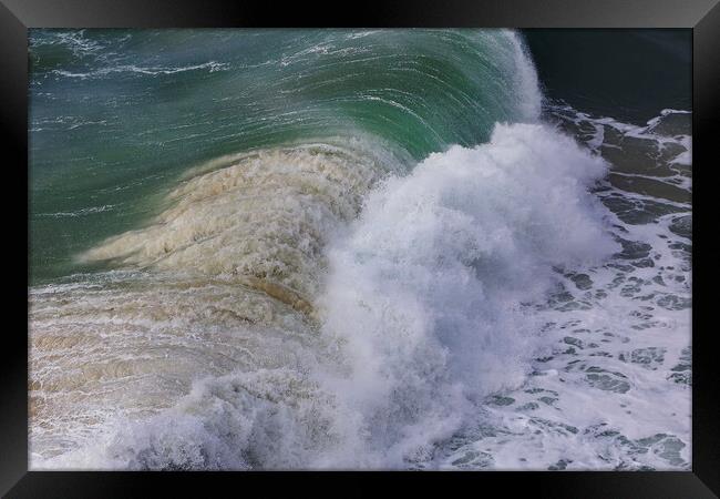Wild wave in Nazare at the Atlantic ocean coast of Framed Print by Olga Peddi