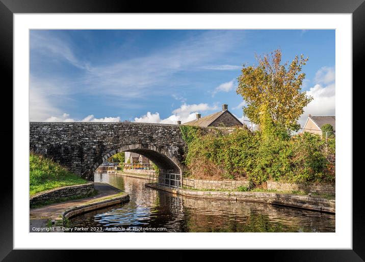 A stone bridge across the Monmouthshire and Brecon Canal. Framed Mounted Print by Gary Parker