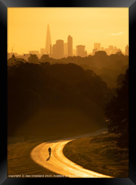 London and a Cyclist at Golden Hour Framed Print by Alan Crossland