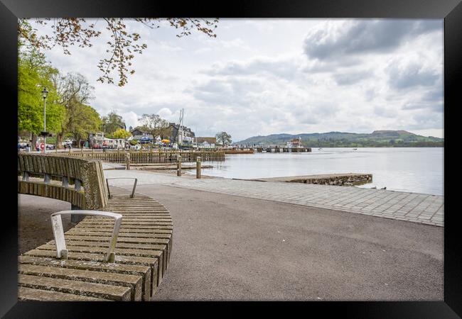 Curved bench overlooking the Ambleside waterfront Framed Print by Jason Wells