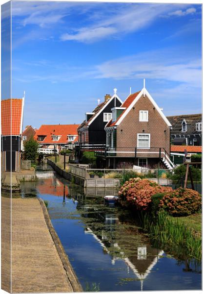 Traditional dutch Village with with colorful house Canvas Print by Olga Peddi