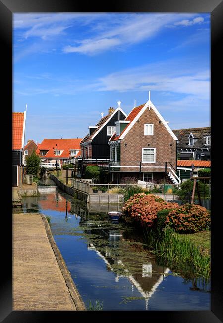 Traditional dutch Village with with colorful house Framed Print by Olga Peddi
