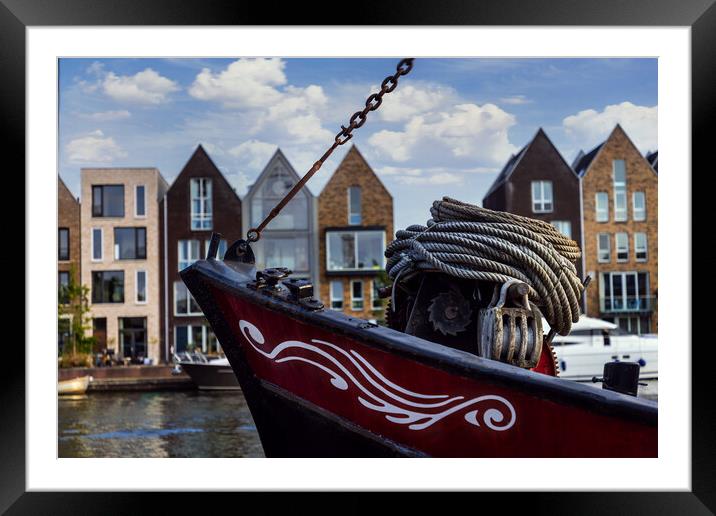 Boat on channel in Haarlem - Holland. Framed Mounted Print by Olga Peddi