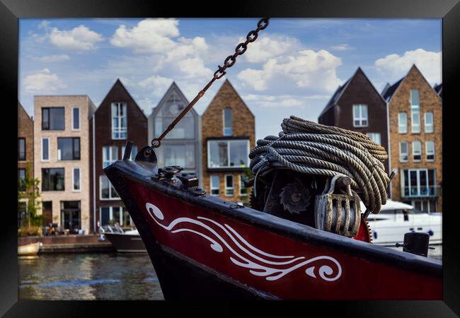 Boat on channel in Haarlem - Holland. Framed Print by Olga Peddi