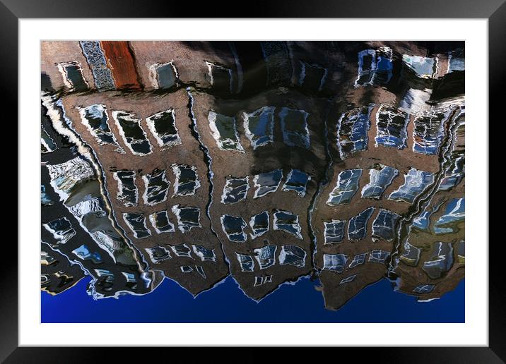 Colourful reflection of a city in a water. Amsterd Framed Mounted Print by Olga Peddi