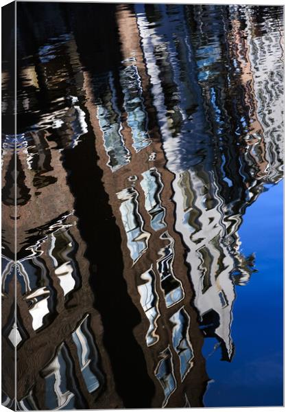 Colourful reflection of a city in a water. Amsterd Canvas Print by Olga Peddi