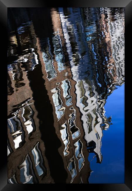 Colourful reflection of a city in a water. Amsterd Framed Print by Olga Peddi