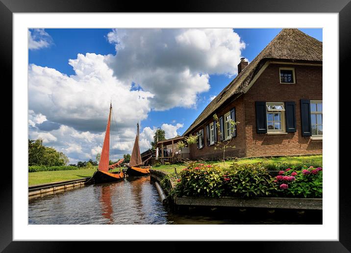 Traditional dutch brick houses with lush green law Framed Mounted Print by Olga Peddi