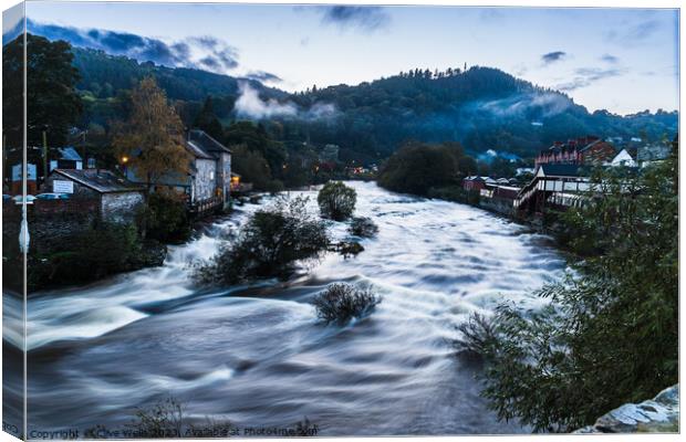 Ghostly mist hangs over the Welsh town of Llangollen Canvas Print by Clive Wells
