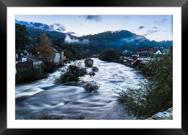 Ghostly mist hangs over the Welsh town of Llangollen Framed Mounted Print by Clive Wells