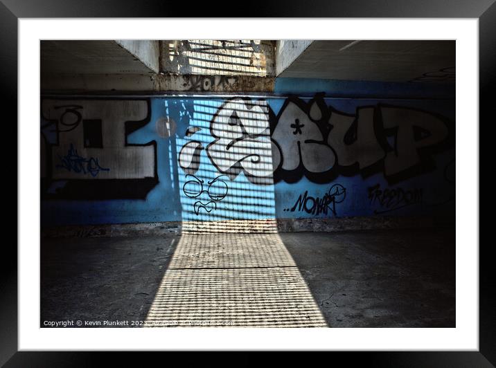 Saigon underpass Framed Mounted Print by Kevin Plunkett