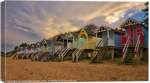 Storm Clouds over Wells Next the Sea Beach Huts Canvas Print by Janet Carmichael