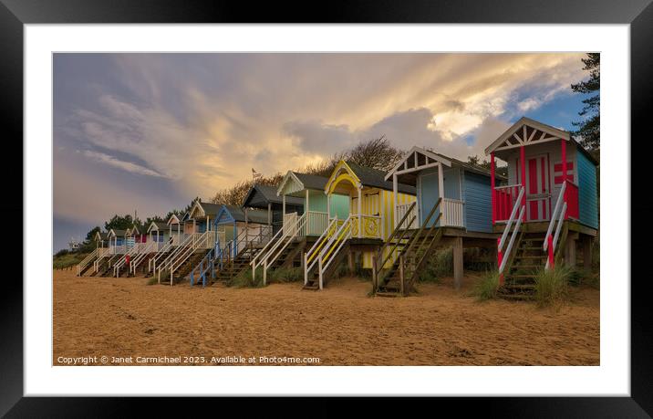 Storm Clouds over Wells Next the Sea Beach Huts Framed Mounted Print by Janet Carmichael