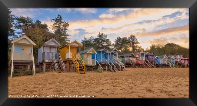 Rainbow Coloured Beach Huts at Wells Next the Sea Framed Print by Janet Carmichael